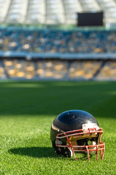 Close Shot American Football Helmet Lying Grass Stadium — стоковое фото