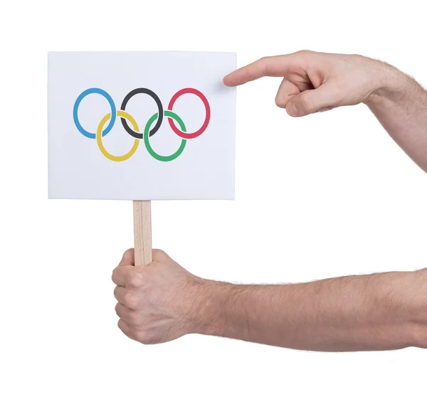 Рука маленькую карточку - флаг Олимпийских игр — стоковое фото