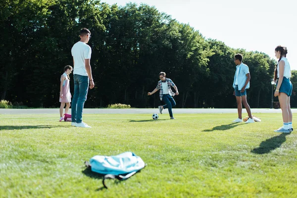 Multiethnic Teenage Classmates Playing Soccer Ball Park — стоковое фото
