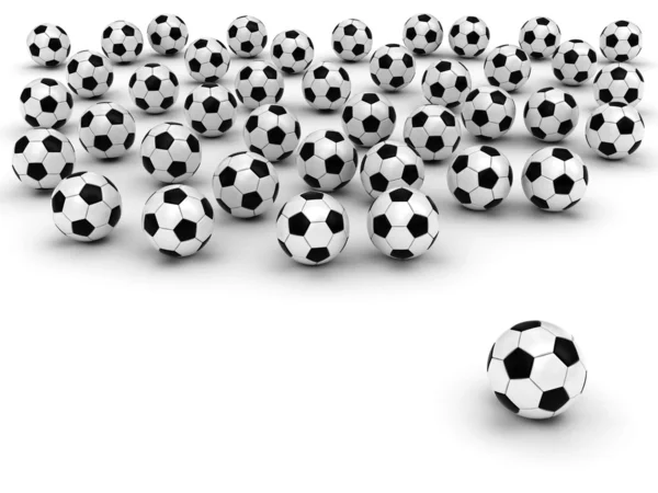 Футбольные мячи на белом — стоковое фото
